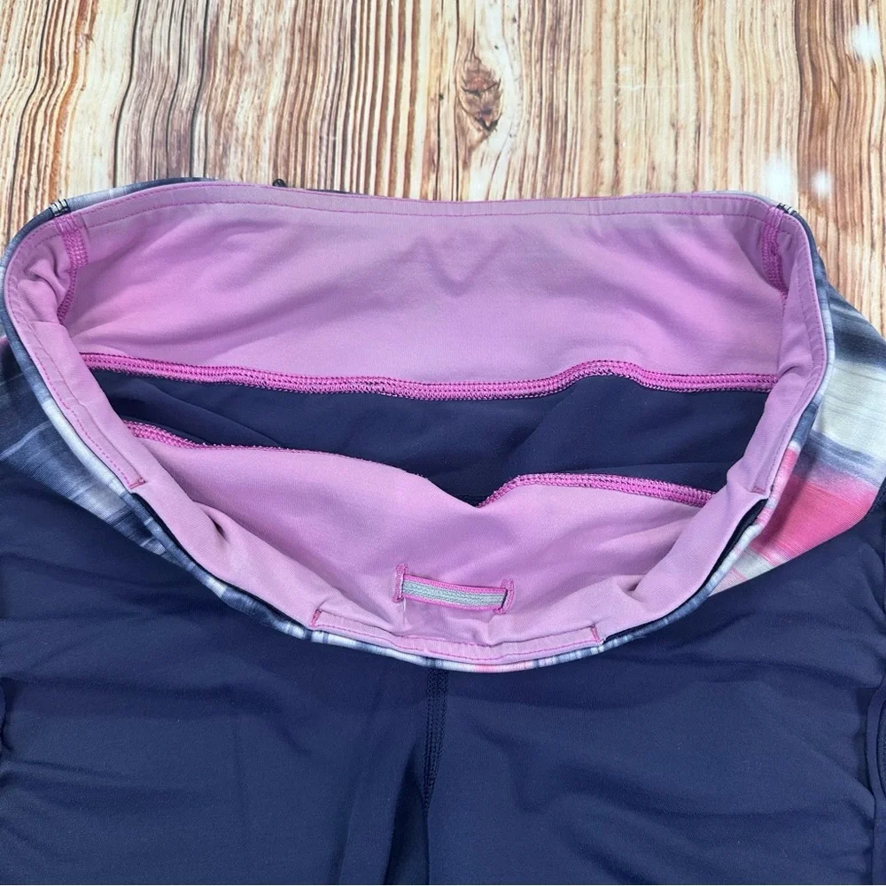 Lululemon Dark Navy ,colorful waist ban and slightly cropped leggings Size 8.